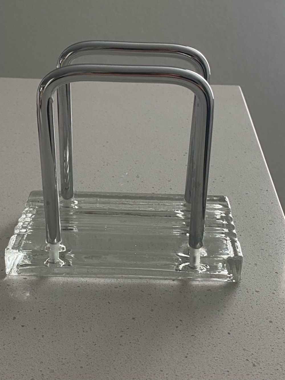 Vintage napkin holder with a solid glass base